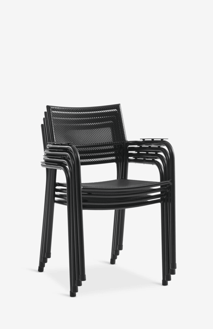 Metal chairs Stack of four black mesh-back metal outdoor armchairs with teak armrests, shown against a plain white background.
