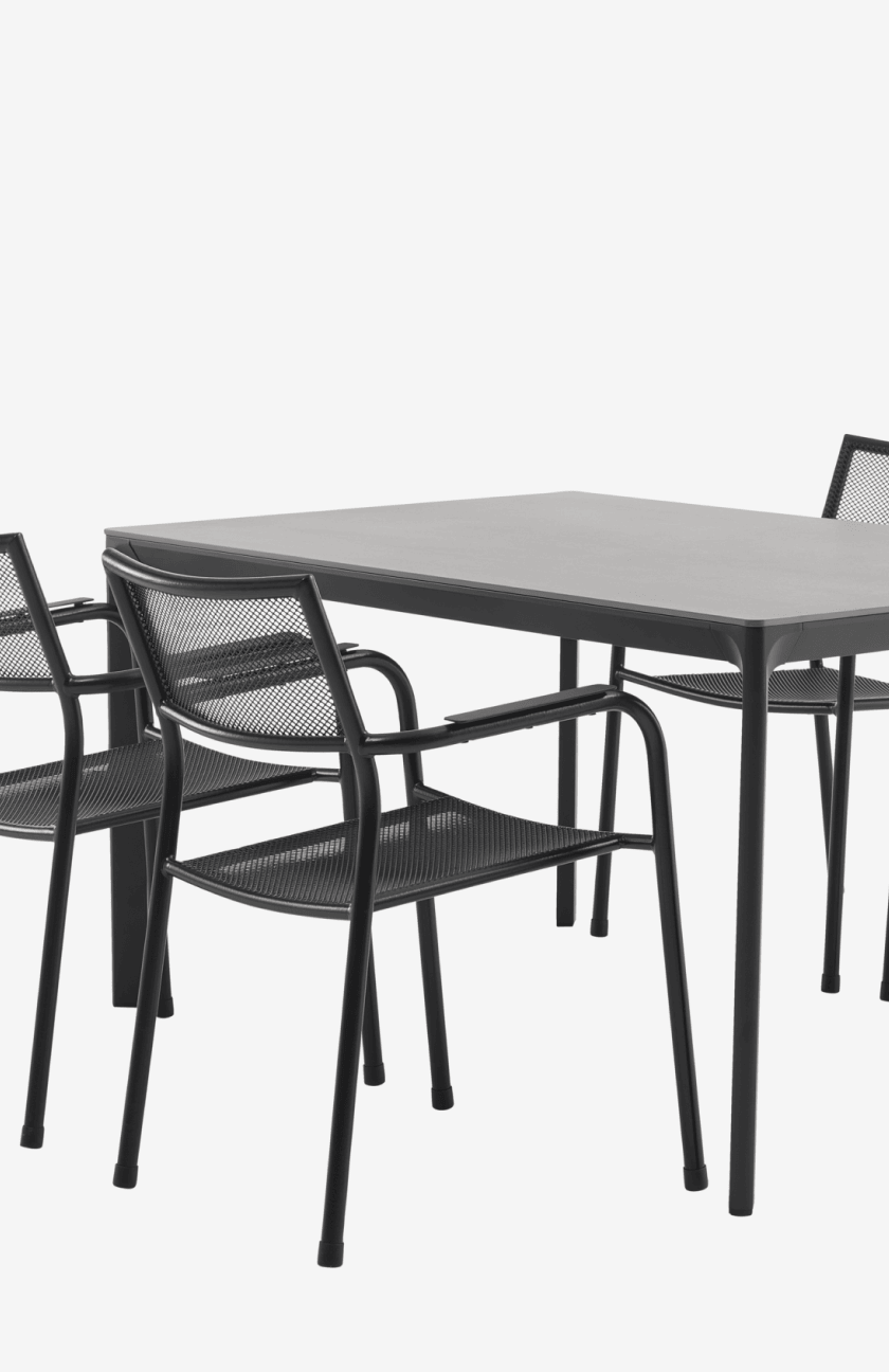 Metal sets Four black mesh-back metal dining chairs around a grey rectangular table, shown against a plain white background.