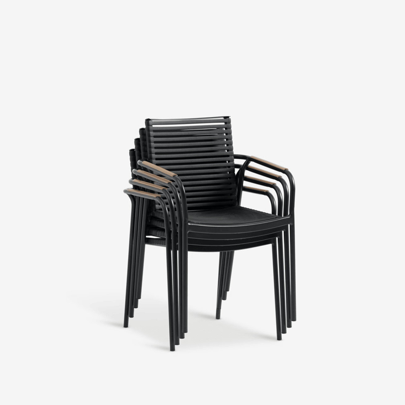 Composite chairs - Square Stack of four black slatted composite outdoor armchairs with teak armrests, shown against a plain white background.