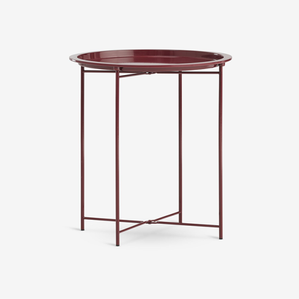 Colours Round burgundy metal tray-top side table with slender legs and a cross brace, shown against a plain white background.