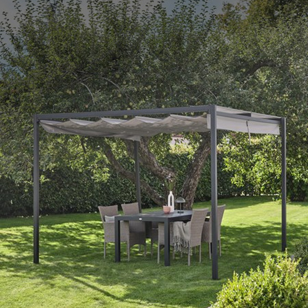 Gazebos and pergolas Dark grey aluminum pergola with a retractable pleated canopy over an outdoor dining table and wicker chairs in a garden.