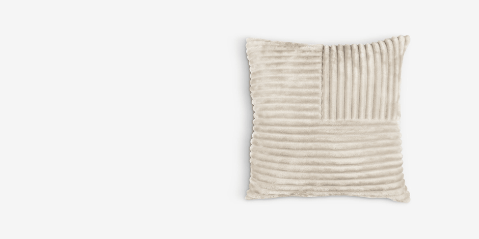 Cushions Beige textured cushion with mixed corduroy-ribbed and smooth velvet panels, shown against a plain light background.