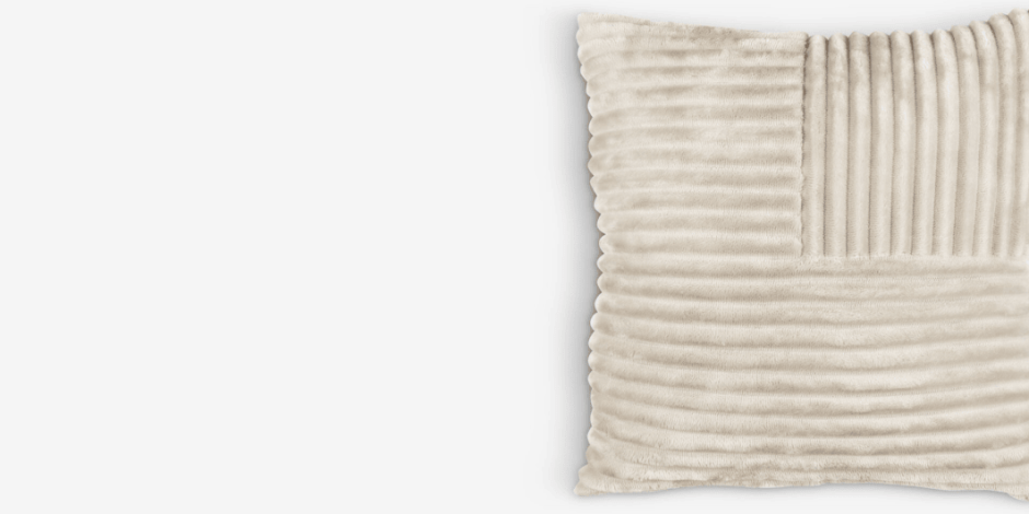 Cushions Beige textured cushion with mixed corduroy-ribbed and smooth velvet panels, shown against a plain light background.