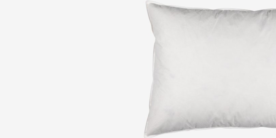 Pillows White rectangular pillow with a quilted feather-filled look, shown against a plain light grey background.
