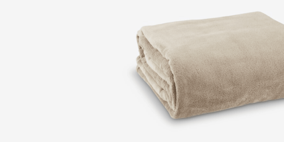 Throws Folded beige fleece throw blanket with a soft plush texture, shown against a plain light grey background.